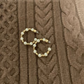 The Elevated Pearl Hoop